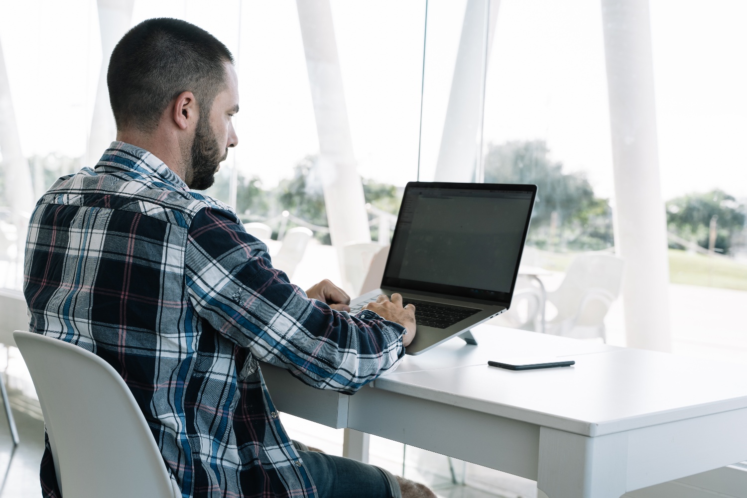 man-working-front-laptop-workspace-1